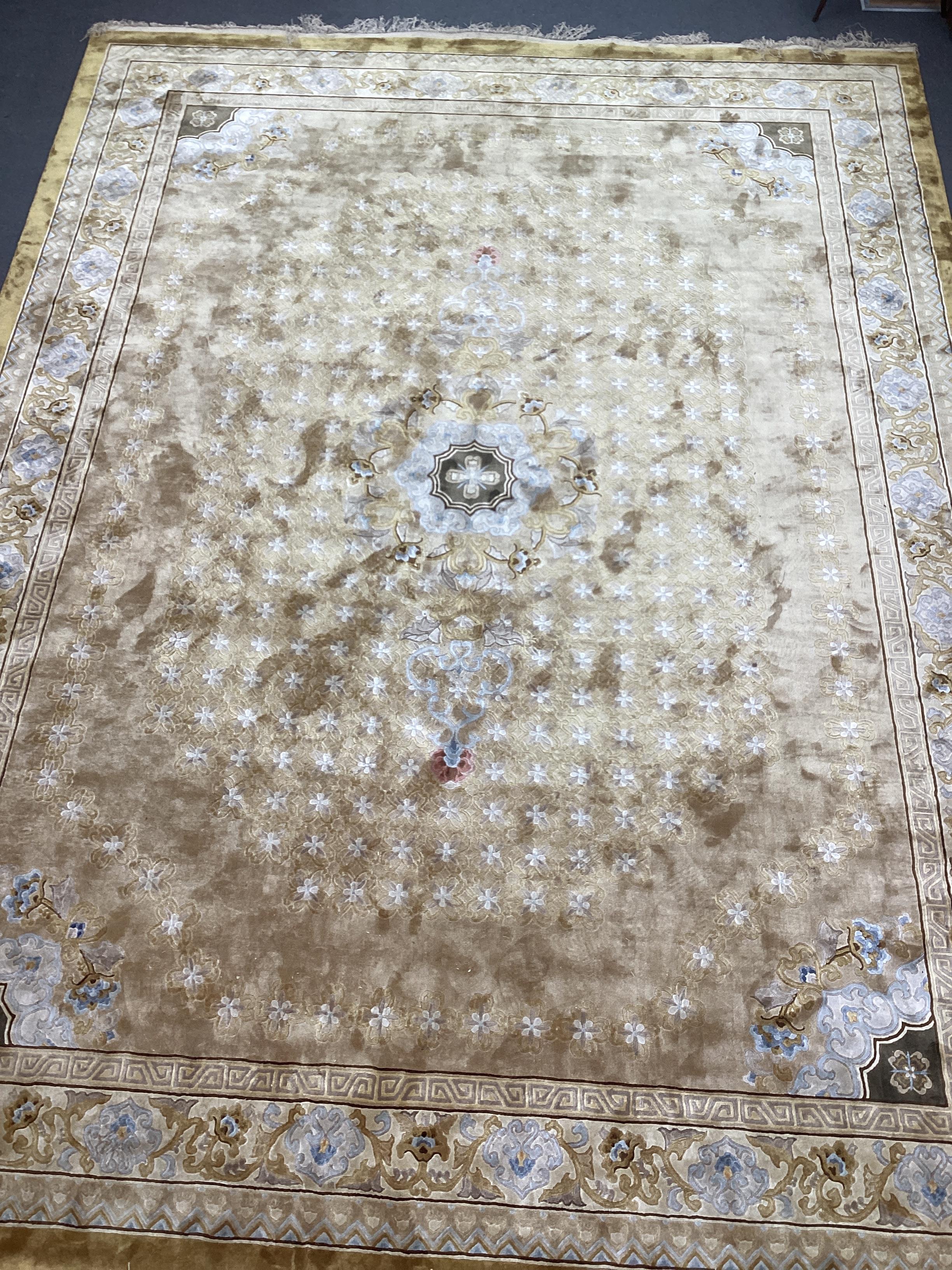 A Chinese gold ground carpet, 370 x 280cm